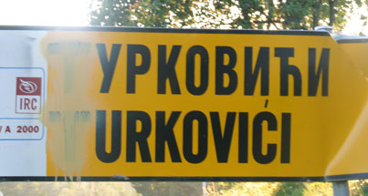 A Bosniak Village road sign that has been defaced by Serb 
nationalists.