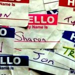 A collection of "Hello My Name Is" nametag stickers, with different names written in, like Vivian, Tom, Jen, and Tyler.