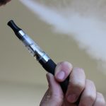 stock photo of someone using an e-cigarette
