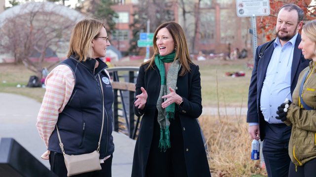 Dianne Criswell (left) talks with Lori Peek, director of the Natural Hazards Center (right).