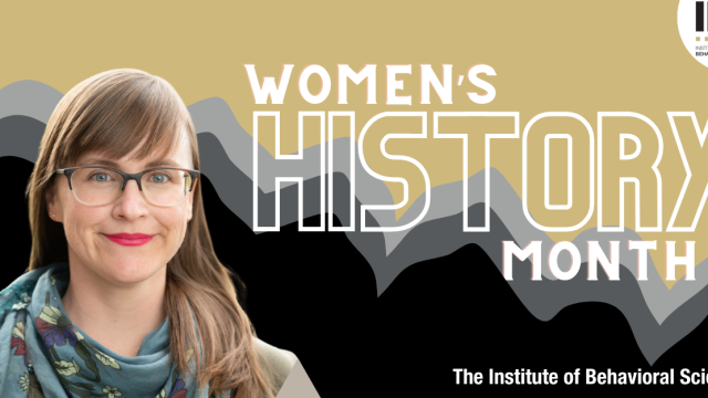 Leslie Root smiles with Women's History Month graphic in the background.