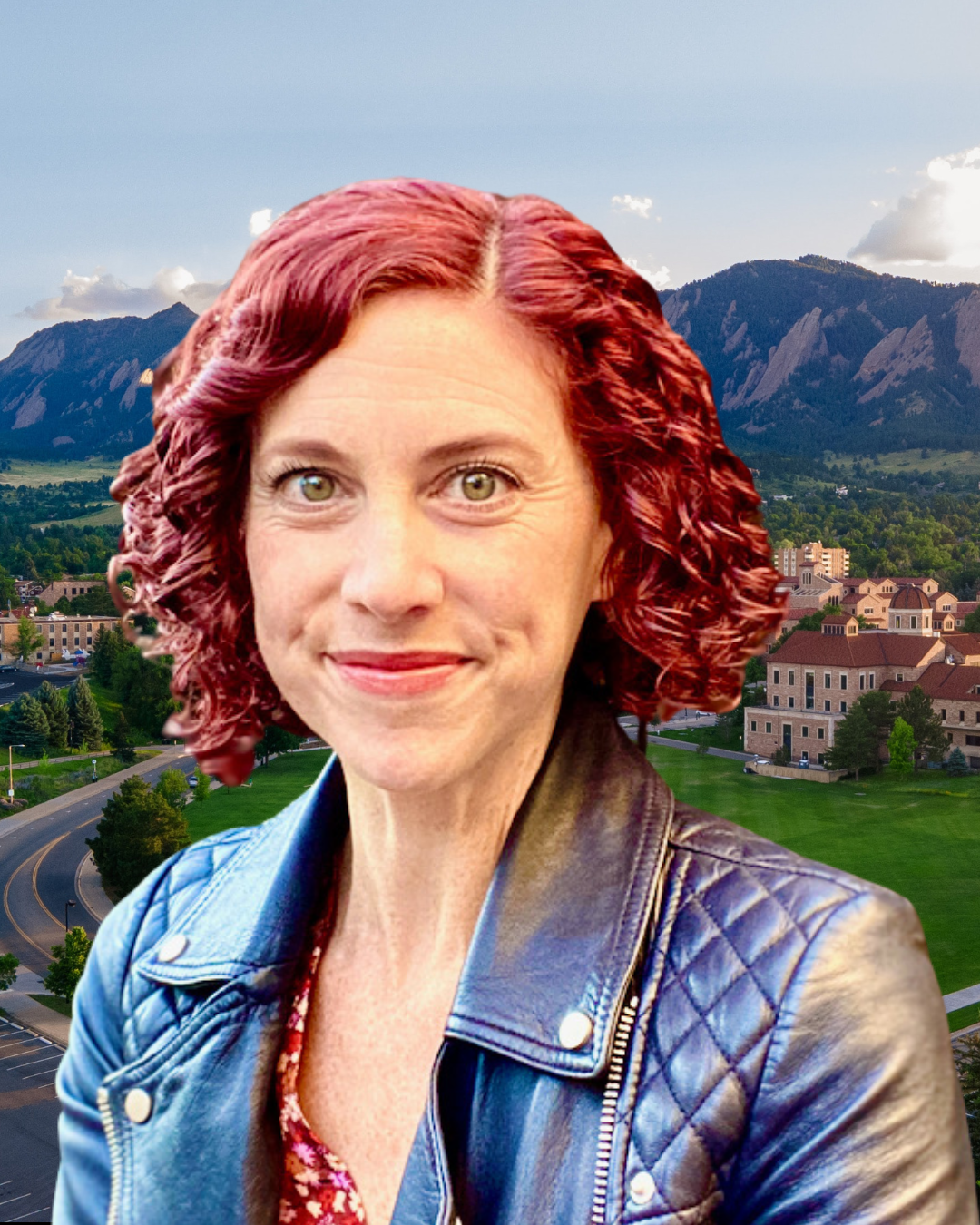 Sharon DeWitte wears a leather jacket. In the background, the CU Boulder campus with view of the Boulder Flatirons.