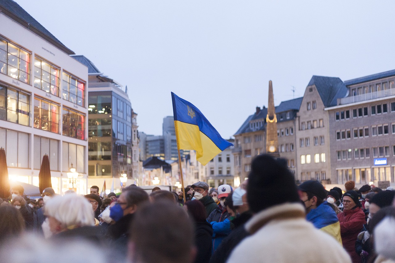 A group of people protest outside of a government building in Ukraine.