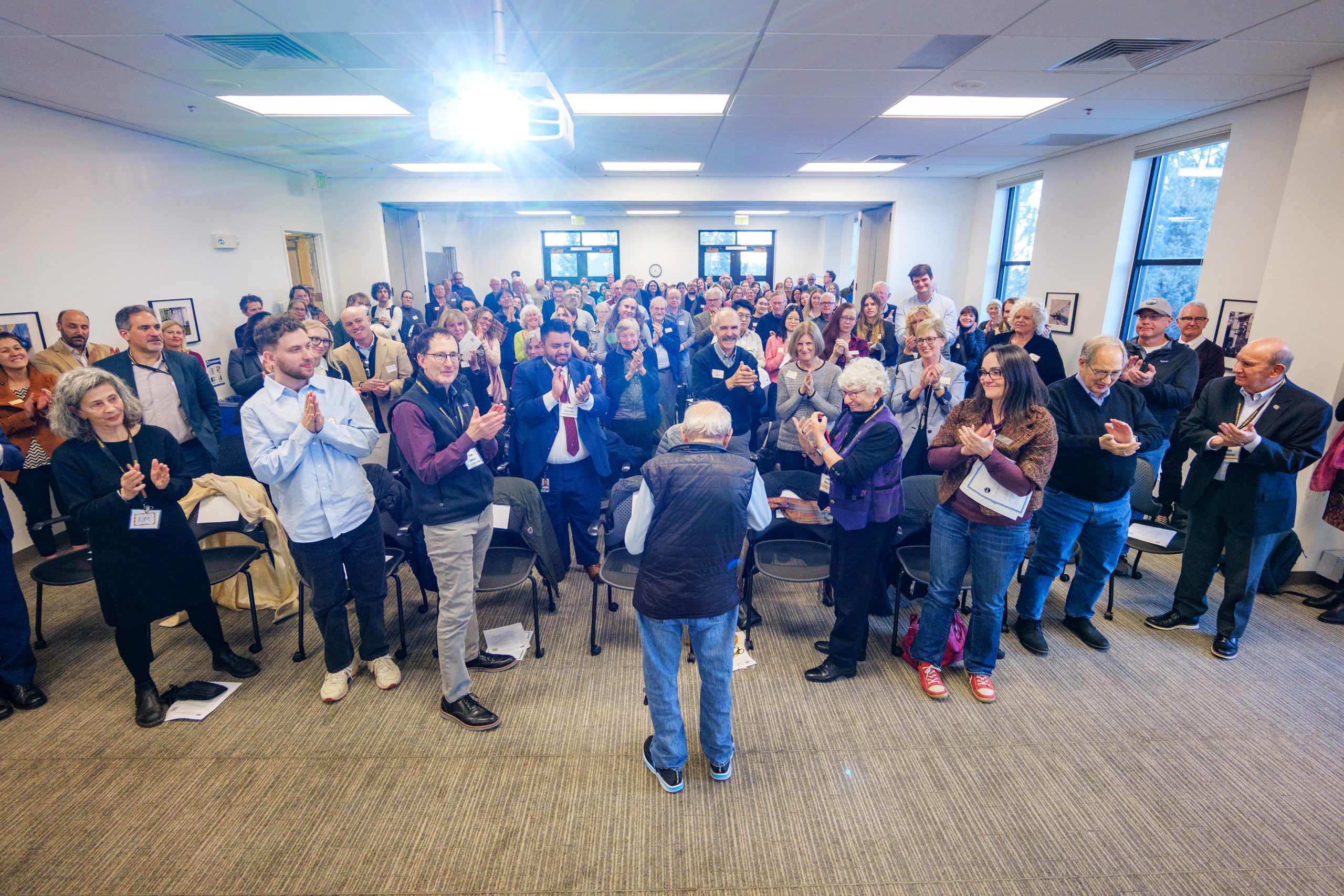 Richard Jessors presents his award to a standing ovation.