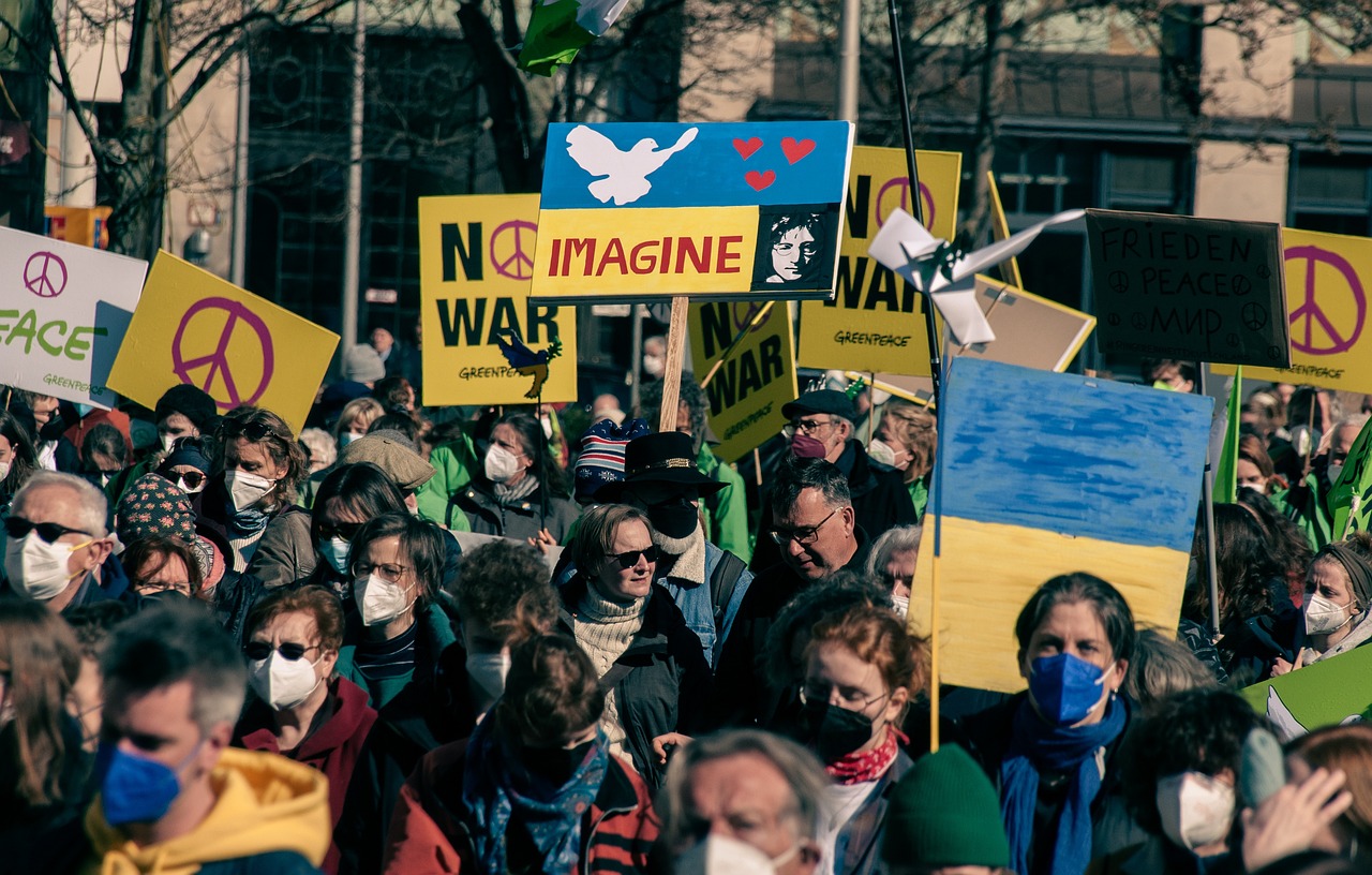 A group of protesters picket for the Russia - Ukrainee war.